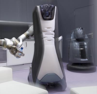  The new Care-O-bot has a highly flexible arm and a three-finger hand with which it can pick up items such as a bottle. Force sensors prevent it from gripping too hard.